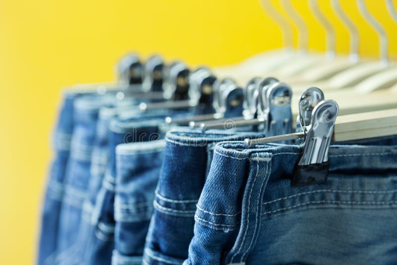 Row of hanged blue jeans stock photo. Image of outfit - 31273478