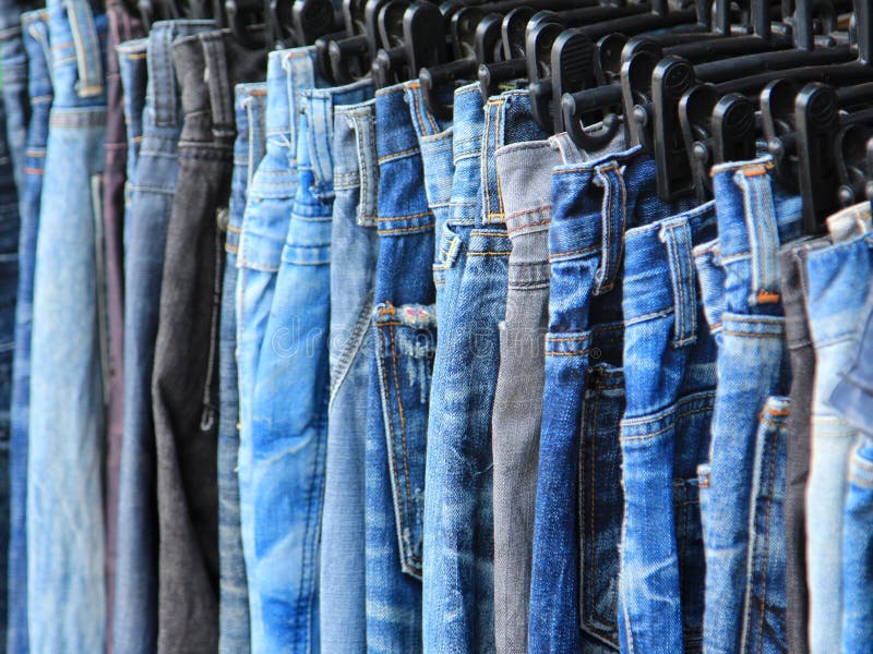 Row of hanged blue jeans stock photo. Image of seam, display - 31291294