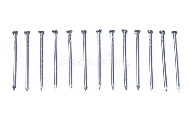 Row of iron nails isolated on white
