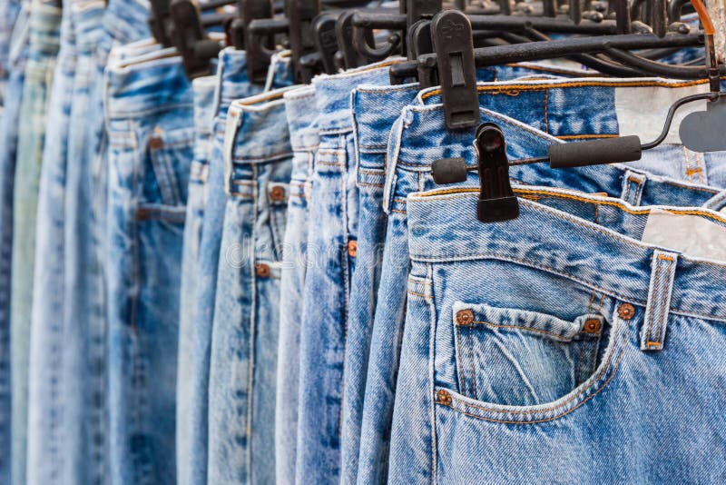 Jeans And Trousers On Hangers Stock Image - Image of boutique, textile ...
