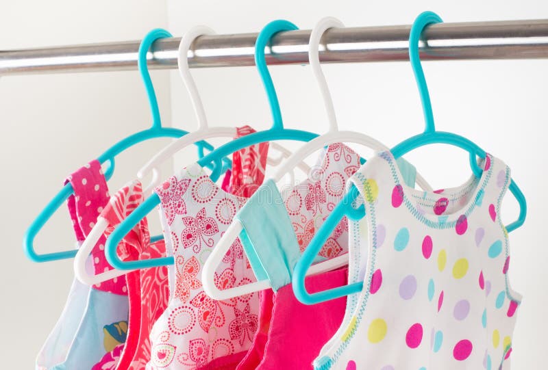 Row of Little Girl Dresses Hanging on Coat Hanger in White Wardrobe ...