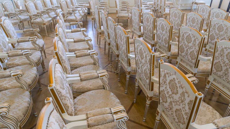 Row of luxury vintage chairs. Chairs for seating the audience at the conference or concert. Theatrical armchairs.