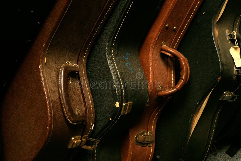 A Row of Old Guitar Cases stock photo. Image of vintage 19067484