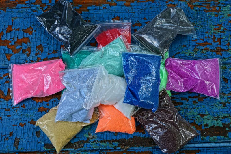Plastic Bags with Colored Sand on a Blue Table Stock Photo Image of