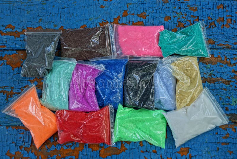 Plastic Bags with Colored Sand on a Blue Table Stock Image Image of