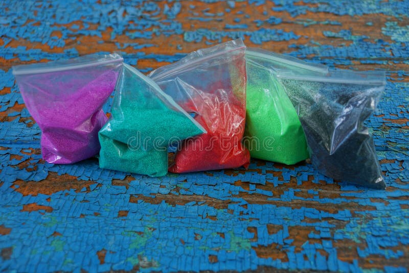 Plastic Bags of Colored Sand on a Blue Table Stock Image Image of coloured, bright 153093183