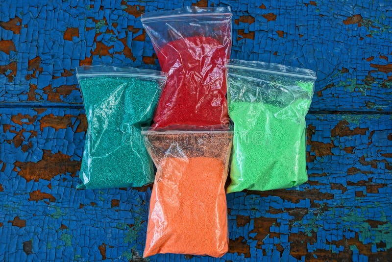 Plastic Bags with Colored Sand on a Blue Table Stock Photo Image of green, industrial 153093132