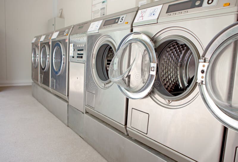 Row of washing machines stock images