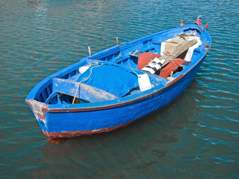 Rowboat in blue sea.