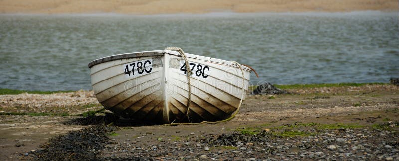 Rowboat on sea shore