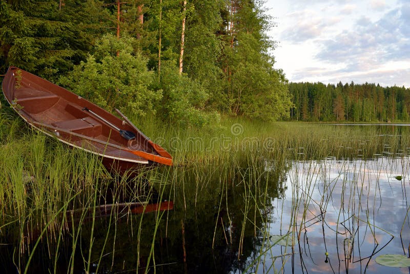 A Rowing Boat on the Lake Shore. Stock Photo Image of scandinavia