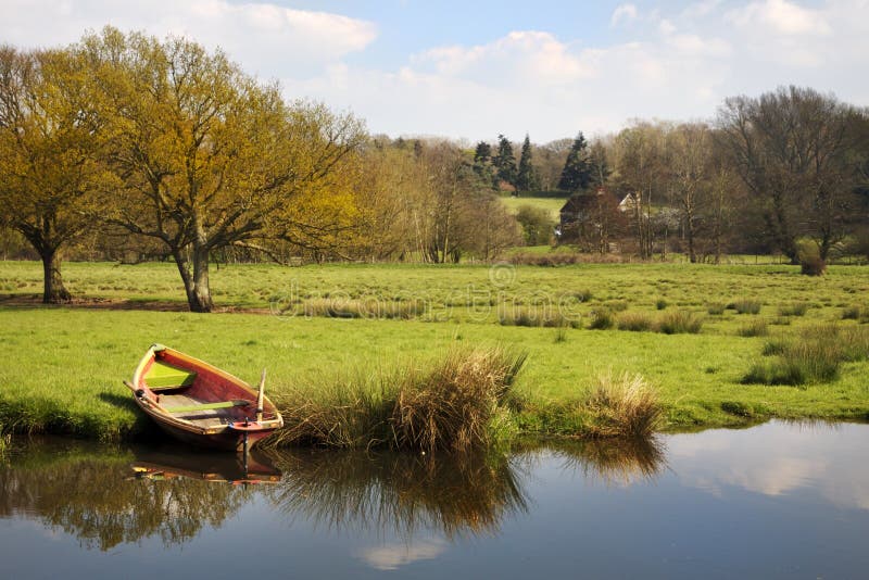 Rowing boat on river bank stock image. Image of peaceful ...