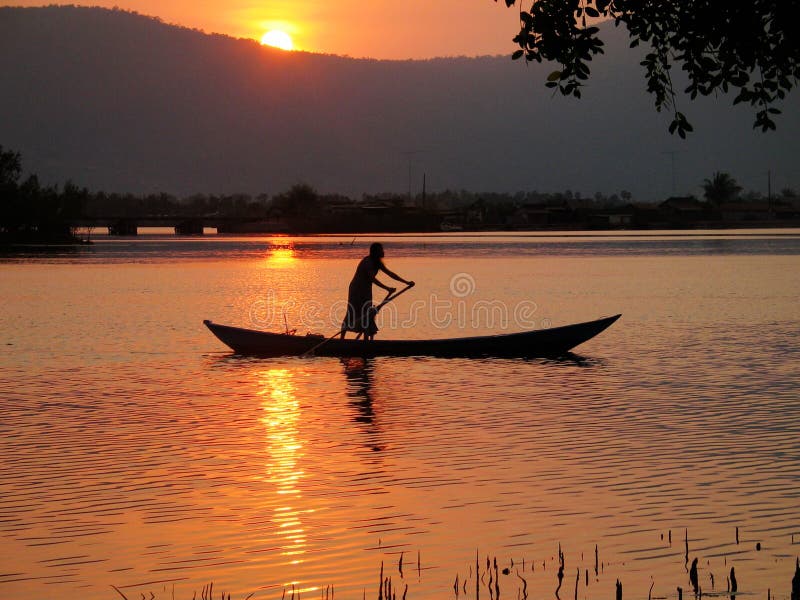 Rowing Boat Silhouette On Tropical River Royalty Free 