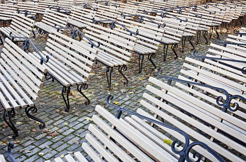 Rows of benches in the autumn park royalty free stock image