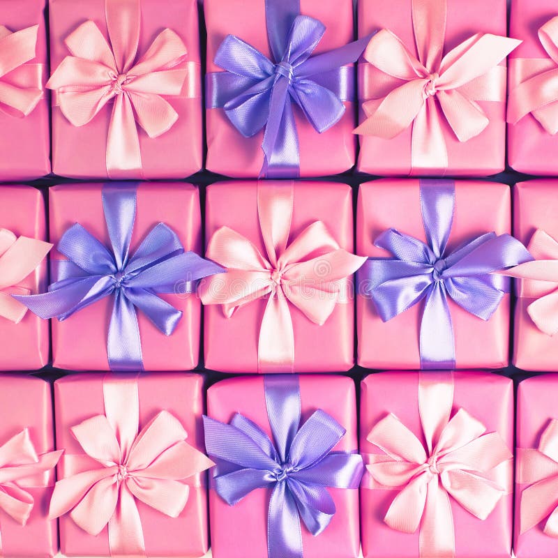 Rows of boxes with gifts decoration ribbon satin bow pink A top view of Flat lay toning stock photos Rows of boxes with gifts decoration ribbon satin bow pink A top view of Flat lay toning stock photos