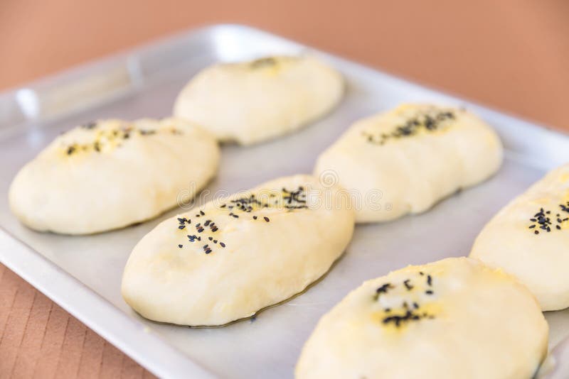 Rows of buns in a bakery stock photo. Image of work, bread 47657534