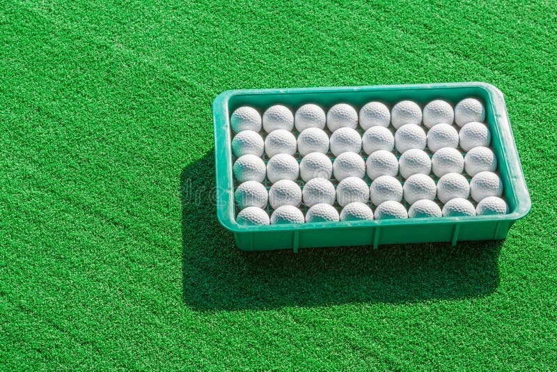 Rows of Golf Balls in Tray on Green, Koh Pha Ngan, Thailand Stock Photo
