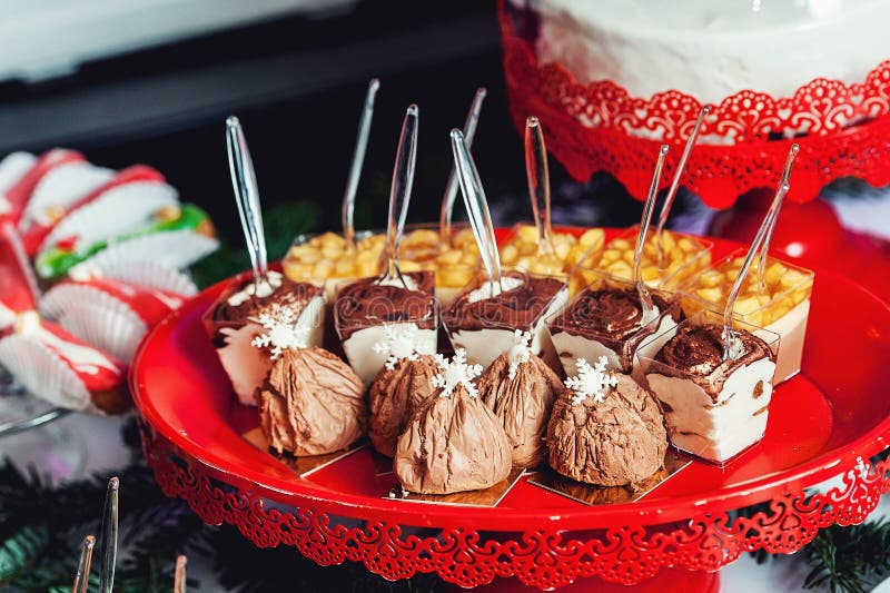 Rows of italian mignon cakes on a red stand