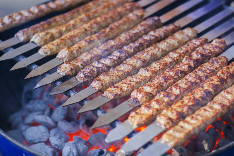 Rows of juicy beef kebab koobideh on grill. Roasted skewer grill stock images, royalty-free photos and pictures