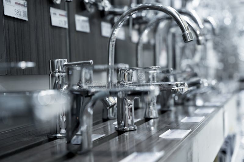 Rows of Metal Water Taps at the Showroom of a Large Store Stock Photo