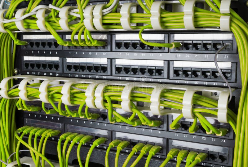 Rows of network cables connected to router and switch hub royalty free stock photos
