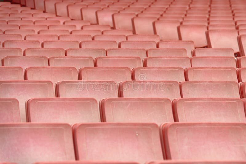 rows of red seats forming a repetitive pattern