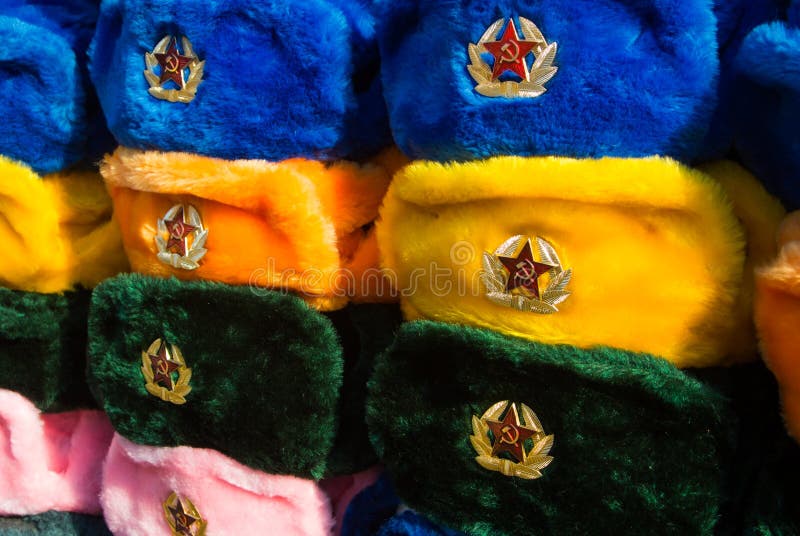 Rows of russian winter hats of different colors with army emblems at the street market at Old Arbat street royalty free stock photos Rows of russian winter hats of different colors with army emblems at the street market at Old Arbat street royalty free stock photos