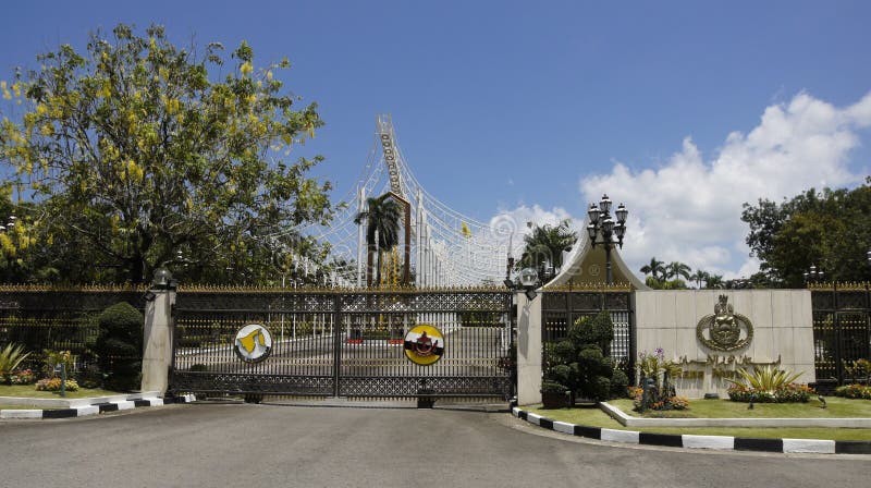 Istana Nurul Iman sultan`s palace in Brunei. The royal crest and a gold-topped black iron fence mark the main entrance to Istana Nurul Iman, the Sultan`s Palace