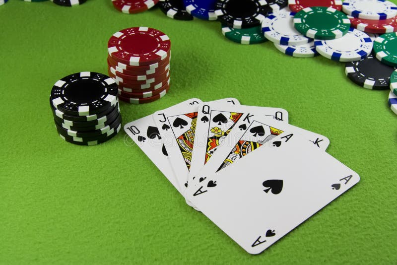 Royal flush in poker cards, chips table