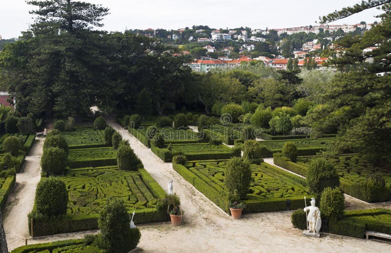 View of the french inspired geometric shaped shrubs of boxwood Buxus sempervirens in the Royal Gardens of Caxias, Portugal. View of the french inspired geometric shaped shrubs of boxwood Buxus sempervirens in the Royal Gardens of Caxias, Portugal