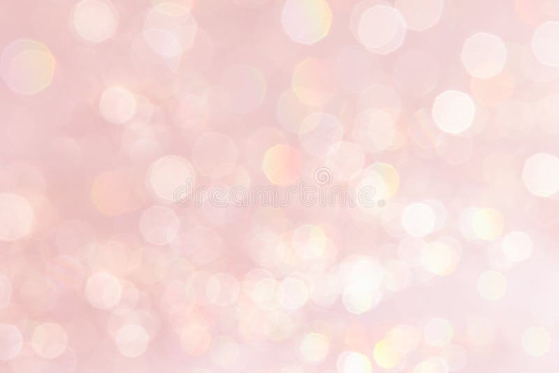 Roze achtergrond van de Bokeh de zachte pastelkleur met vage gouden lichten