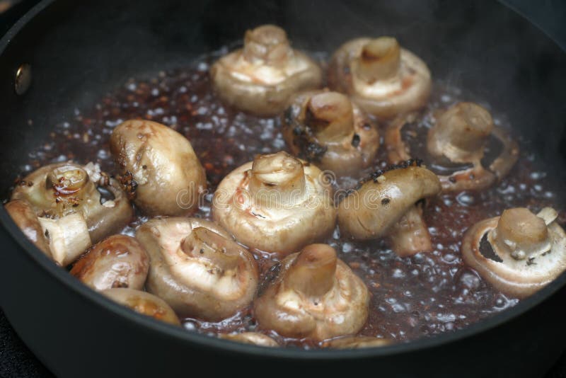 Mushrooms being cooked. Mushrooms being cooked.