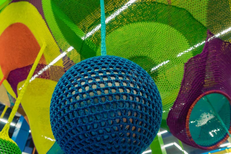 Rubber Ball, Covered with Blue Woven Mesh. Abstract Texture of Multi