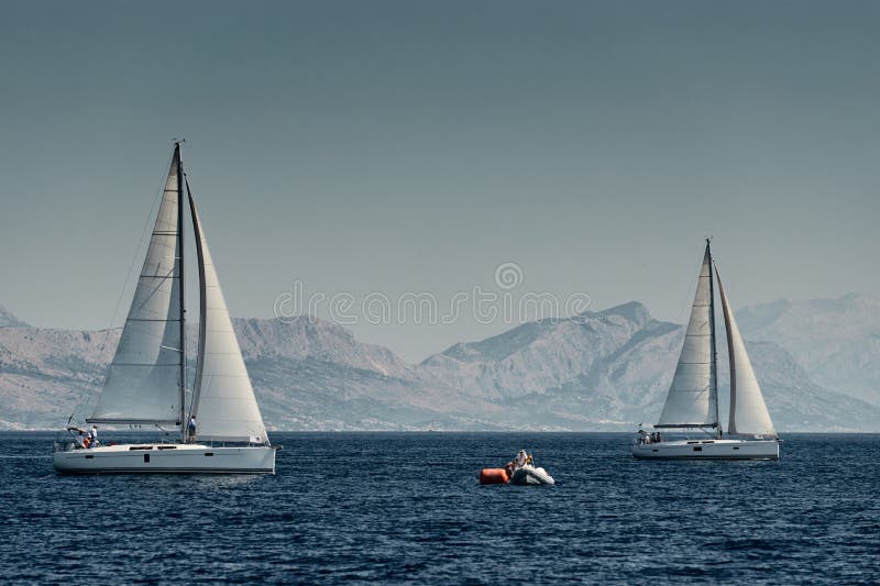 The Rubber Boat of Organizers of a Regatta with the Judge and Balloon of  Orange Color, the Race of Sailboats, Intense Stock Photo - Image of  recreation, freedom: 178126218