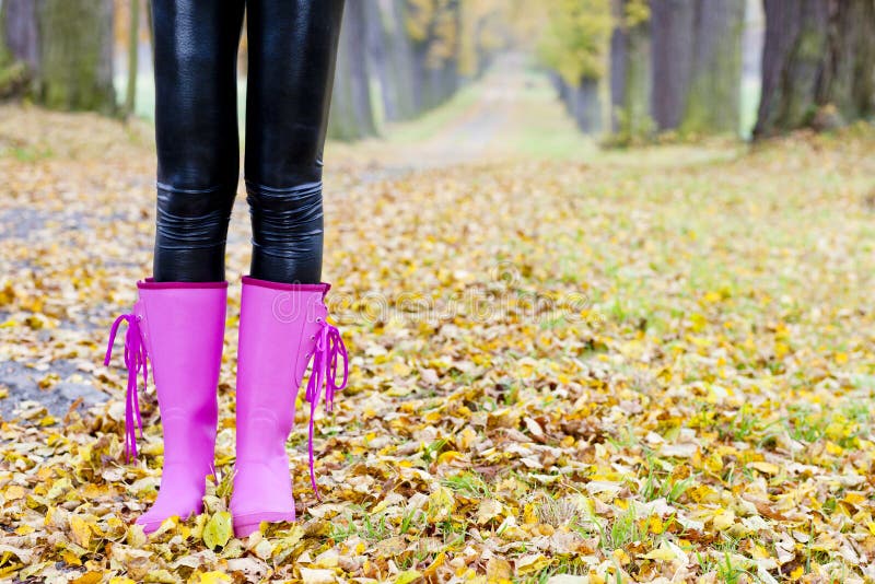 Woman wearing rubber boots stock photo. Image of fashion - 23011498