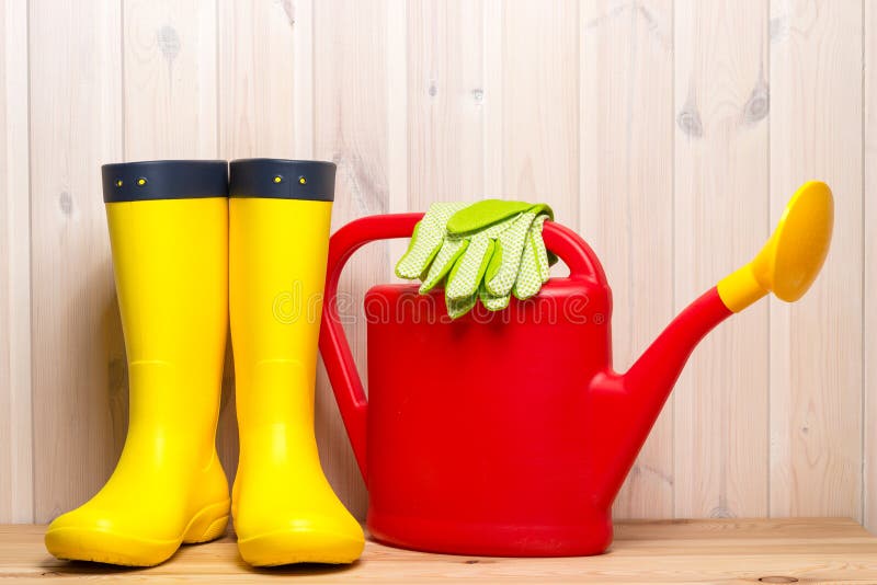 Rubber Boots, Watering Can and Gardening Gloves in Spring Objects on