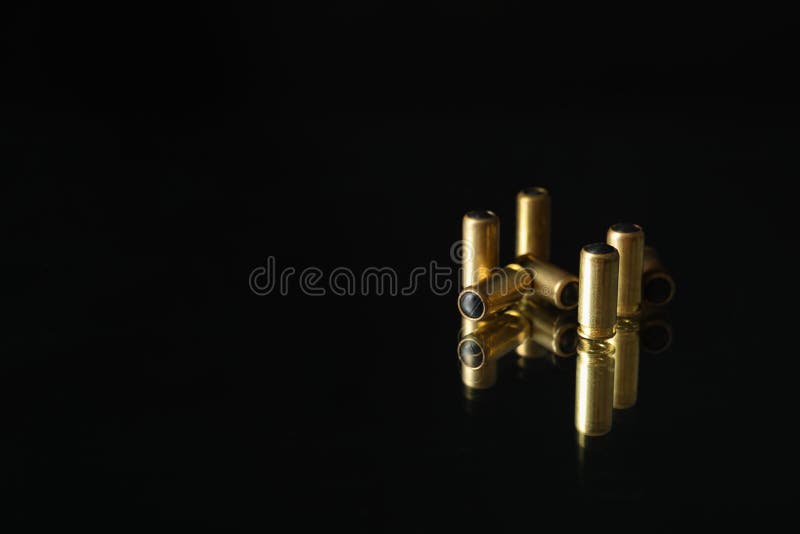 Rubber Bullets on Blue Background Top View. Self Defense Weapon Stock