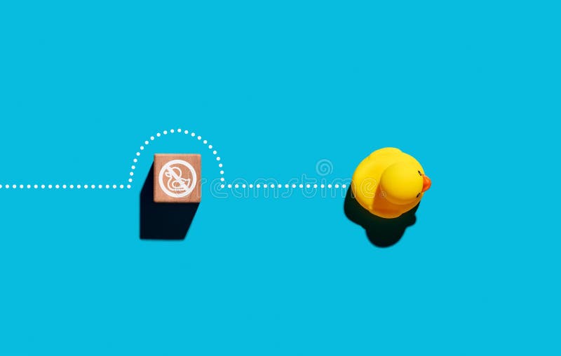 Rubber duck exceeds the barrier of entry. To overcome the obstacles, breaking the rule or to conquer adversity royalty free stock image
