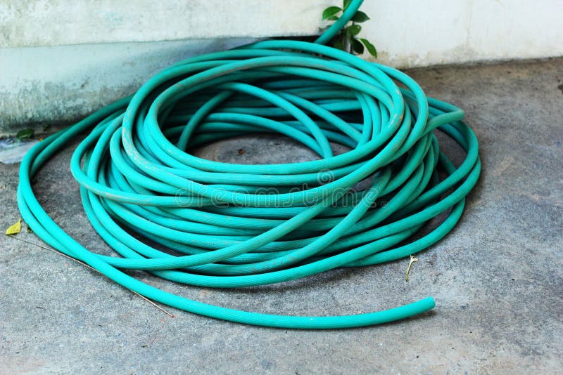Rubber Tube on the Cement Floor Stock Photo Image of paint, grass