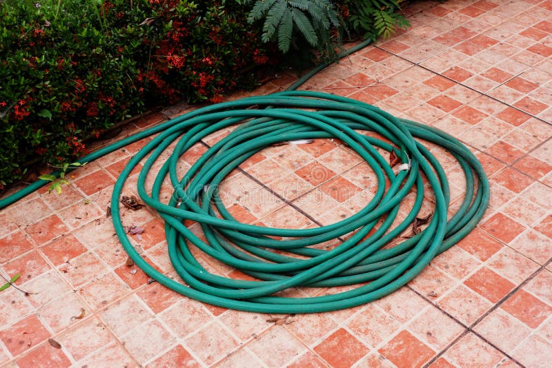Rubber water hose stock photo. Image of gardening, construction 85064026