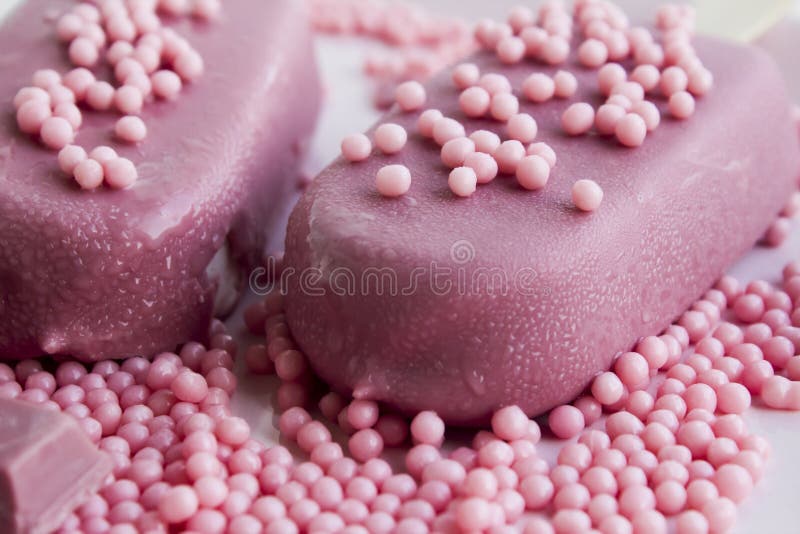 Ruby chocolate bar and ice cream on the white porcelain plate stock photo