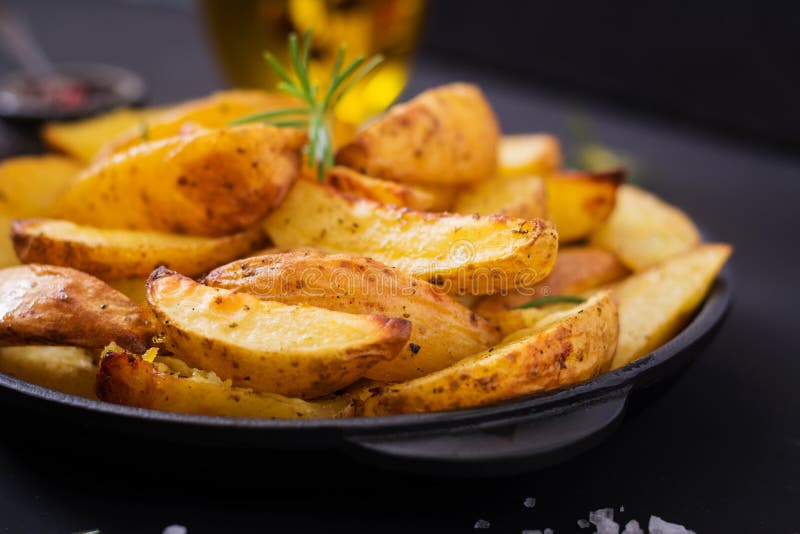 Ruddy Baked potato wedges with rosemary and garlic