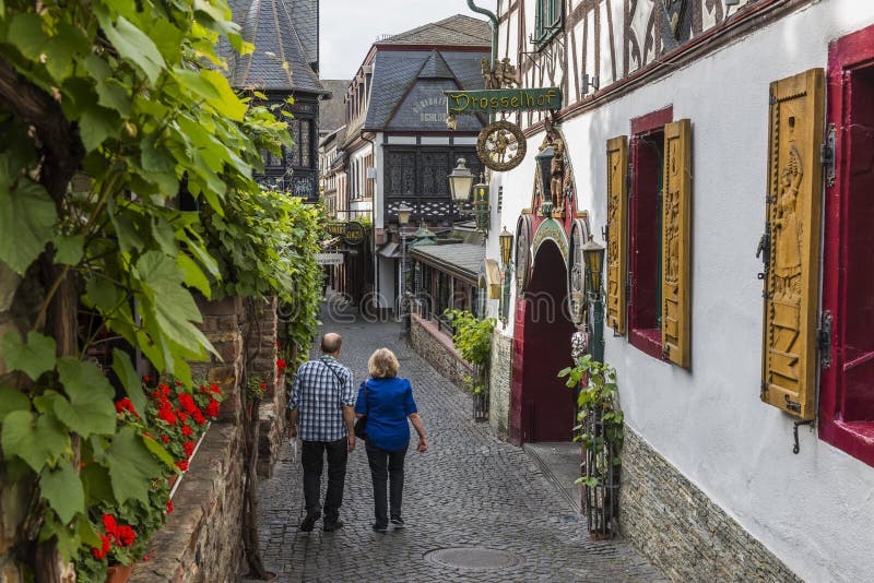 Rudesheim, Germany - August 20,2016: Drosselgasse with tourists in Rudesheim near the river Rhine. Rudesheim, Germany - August 20,2016: Drosselgasse with tourists in Rudesheim near the river Rhine.