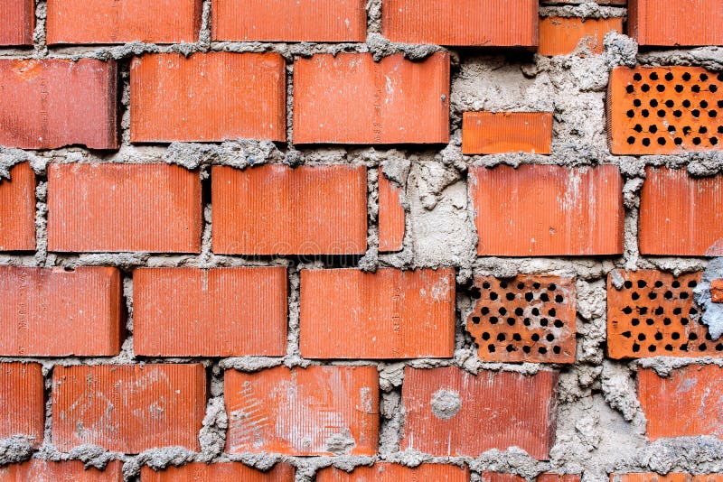 Wall of large red bricks - texture or background. Wall of large red bricks - texture or background