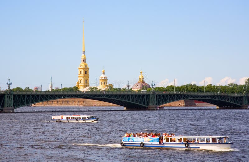 Boat excursions on the Neva river in St.Petersburg, Russia. View of Peter and Paul Fortress and Trinity Bridge. Boat excursions on the Neva river in St.Petersburg, Russia. View of Peter and Paul Fortress and Trinity Bridge