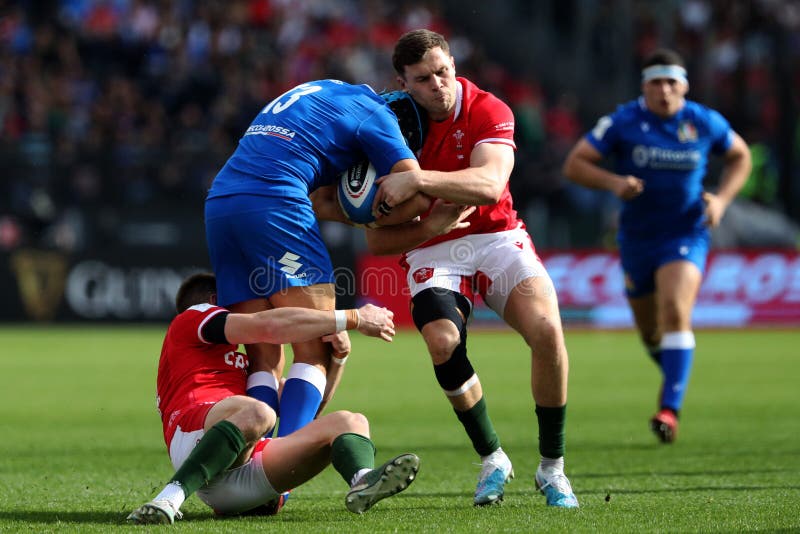 Rome,Italy,11.03.2023: JOSH ADAMS (WALES),JUAN IGNACIO BREX (ITA),MASON GRADY (WALES) in action during the 2023 Guinness Six Nations Championship round 3 rugby match between Italy and Wales at Olympic Stadium in Rome. Rome,Italy,11.03.2023: JOSH ADAMS (WALES),JUAN IGNACIO BREX (ITA),MASON GRADY (WALES) in action during the 2023 Guinness Six Nations Championship round 3 rugby match between Italy and Wales at Olympic Stadium in Rome