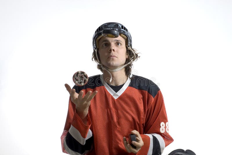 Rugby Player Tossing a Hockey Puck - Horizontal