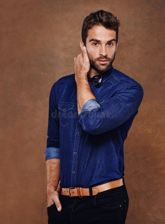 Rugged Good Looks and Style. Studio Shot of a Stylishly Dressed Young ...