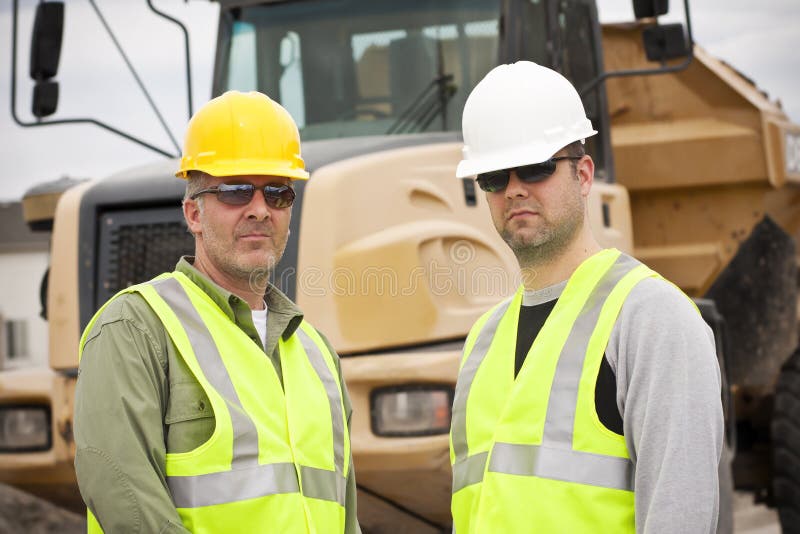 Rugged Male Construction Workers on the job