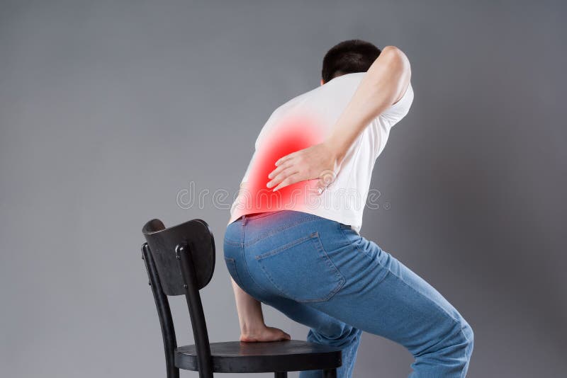 Back pain, kidney inflammation, man suffering from backache, painful area highlighted in red. Back pain, kidney inflammation, man suffering from backache, painful area highlighted in red